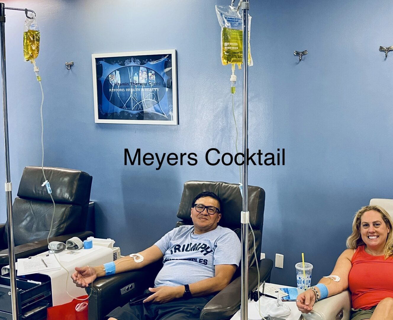 A man sitting in a chair with a blood bag on his arm.