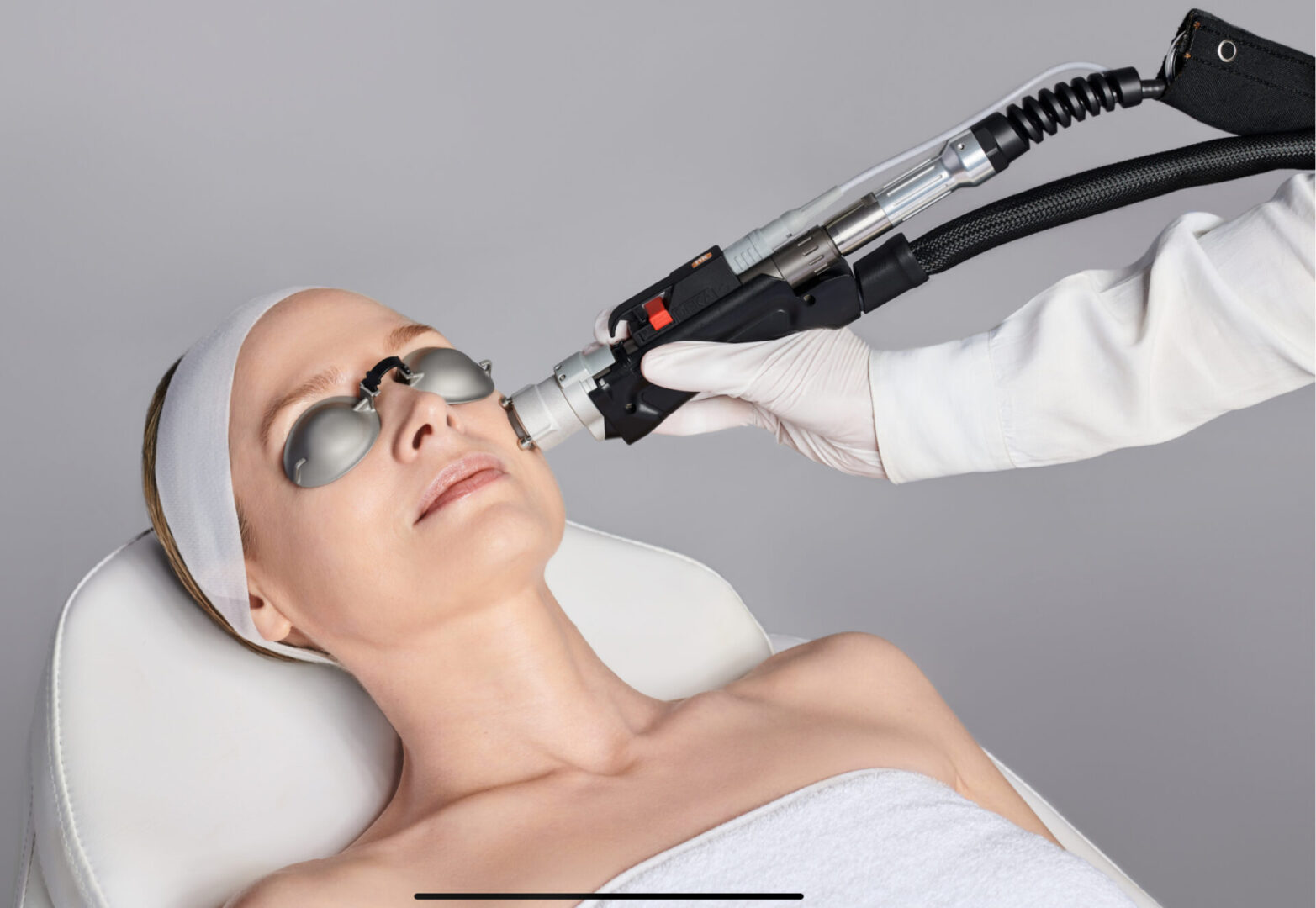 A woman getting her face waxed at the spa